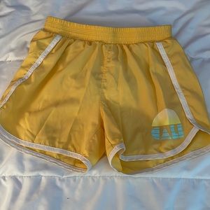 yellow athletic shorts